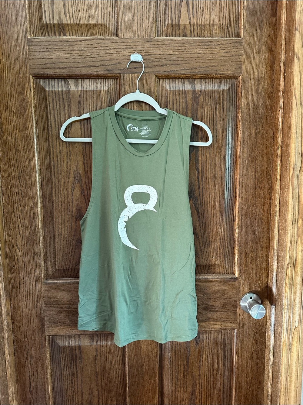 ZYIA Olive Muscle Tee with White Kettlebell Crescent Logo